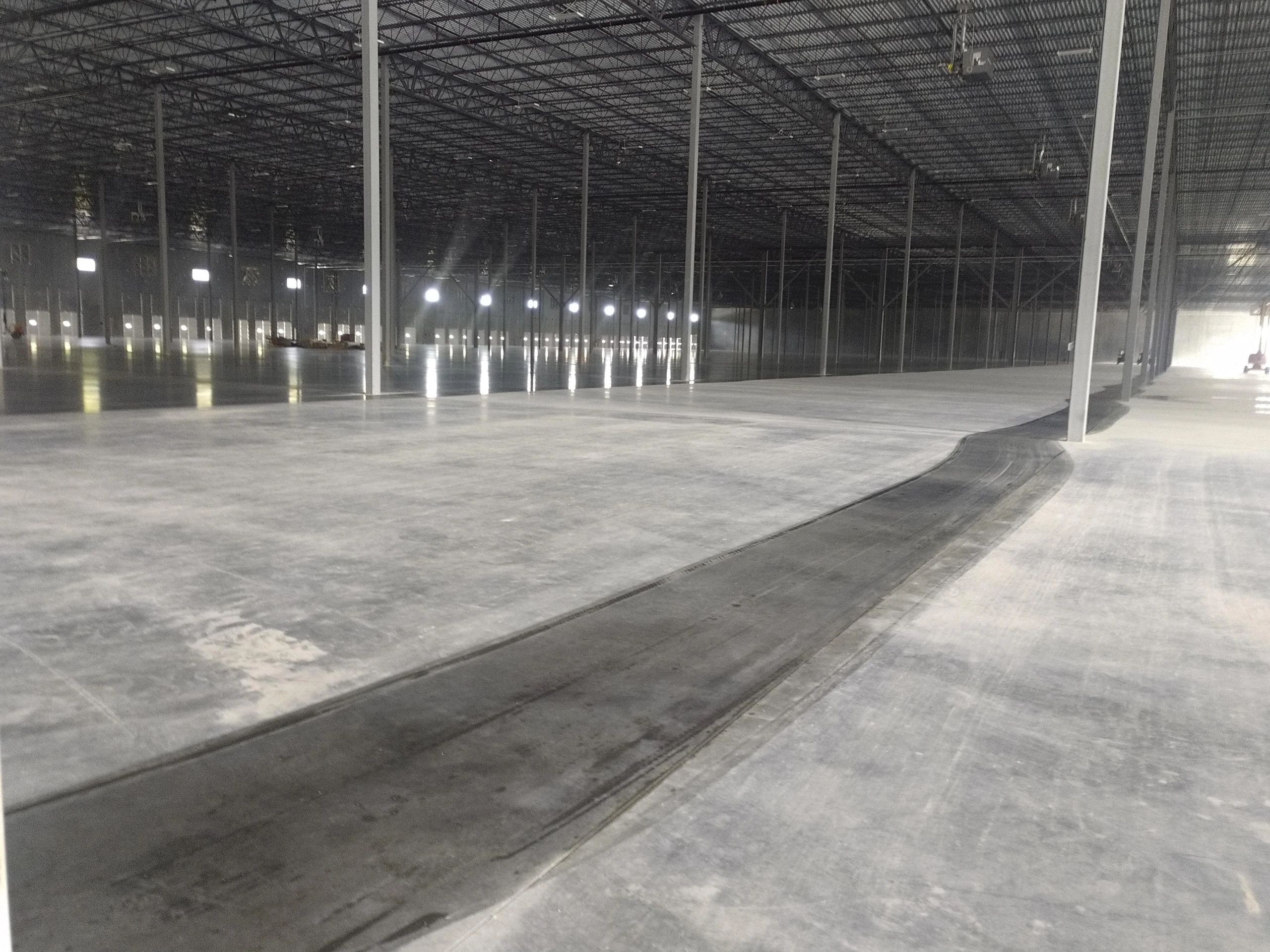 Concrete floor polishing in warehouse
